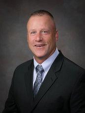 man smiling in blazer